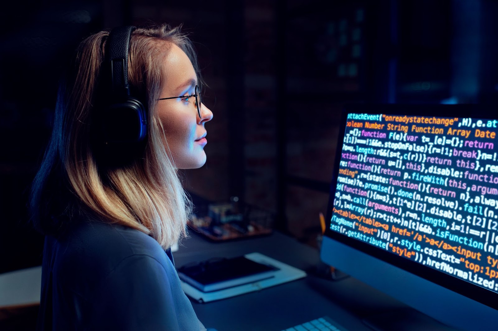 A female programmer works at a computer